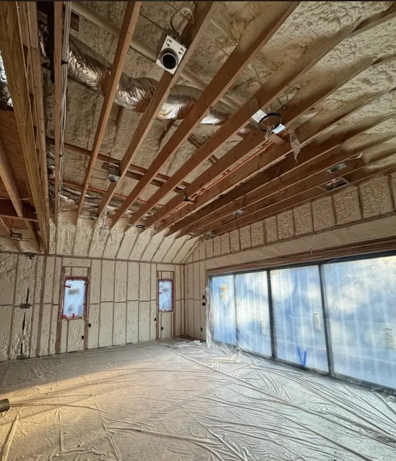 Interior walls and ceiling insulated with spray foam during new construction in Bellwood